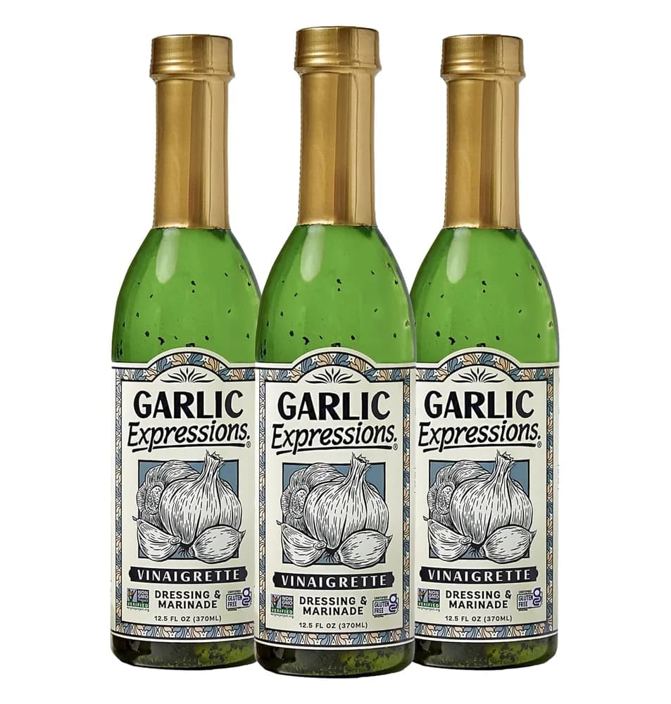 Three bottles of Garlic Expressions vinaigrette dressing and marinade.